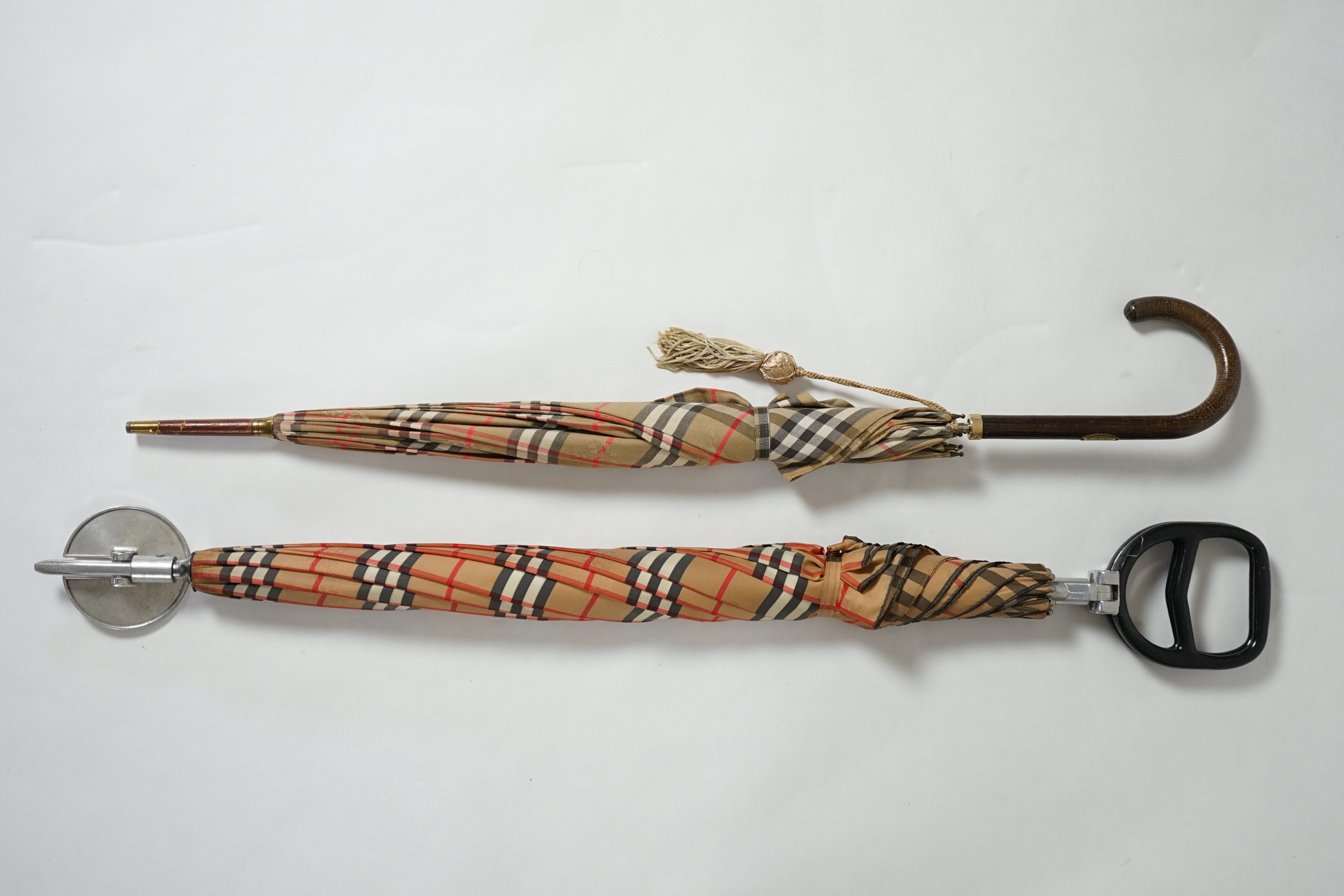 A vintage Burberry shooting stick umbrella and a lady's vintage cotton umbrella, shooting stick height 91cm, umbrella 83cm